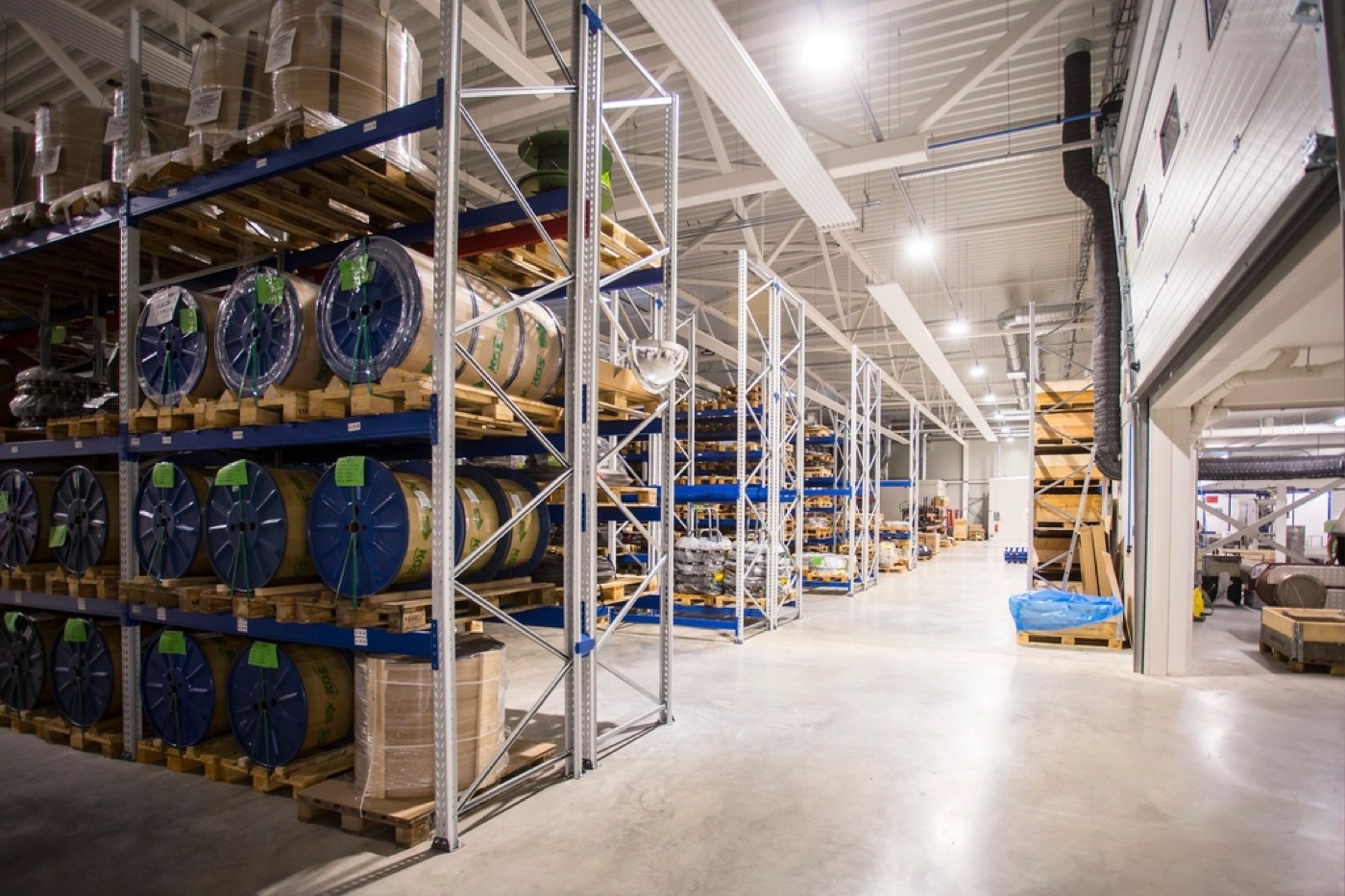 Industrial storage racks holding palletized inventory inside a distribution warehouse