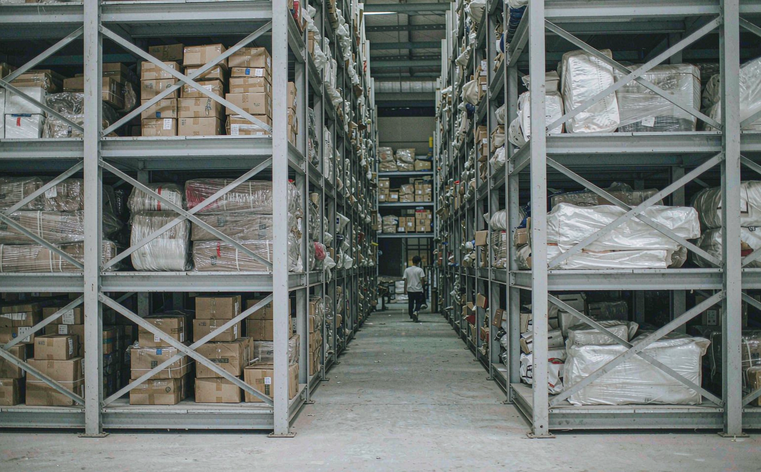 Warehouse aisle with inventory on shelves